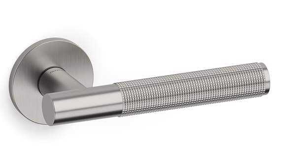 Metallic door handle with textured grip on a white background