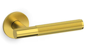 Gold door handle on a white background