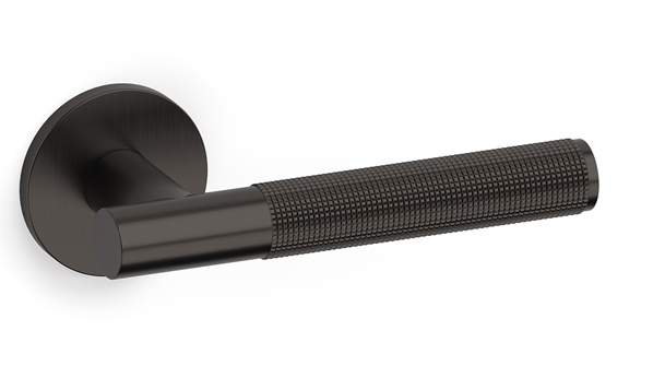 Black textured door handle on a white background