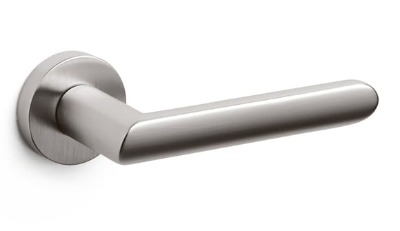 Stainless steel door handle on a white background