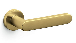 Gold door handle on a white background