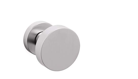 Round metallic door handle on a white background