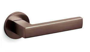 Bronze door handle on a white background