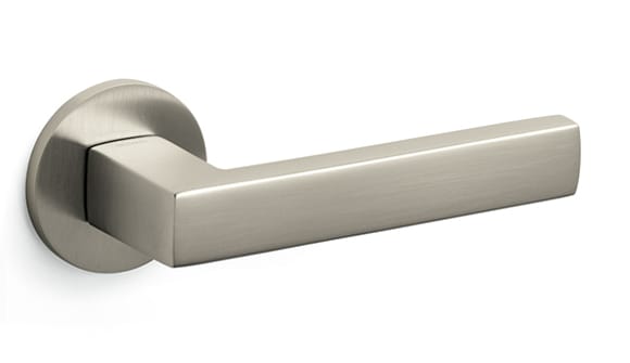 Metallic door handle on a white background