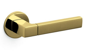 Gold door handle on a white background
