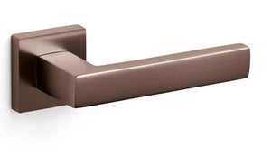 Bronze door handle on a white background