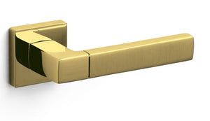 Gold door handle on a white background