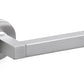 Stainless steel door handle on a white background