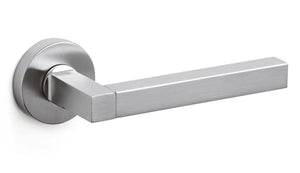 Stainless steel door handle on a white background