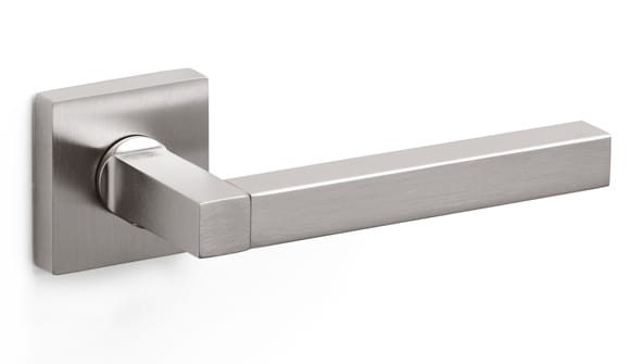 Stainless steel door handle on a white background