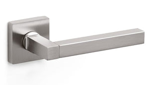 Stainless steel door handle on a white background
